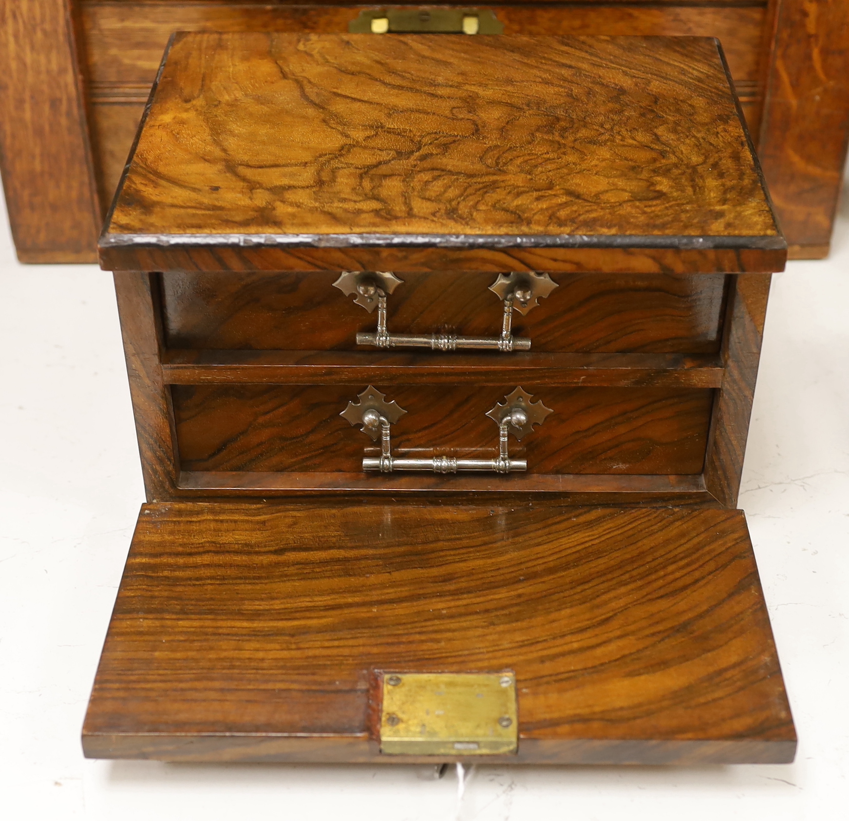 A small walnut case enclosing two drawers